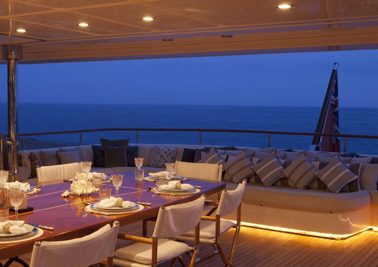 a table set for a dinner aboard BEHIKE Yacht for Sale