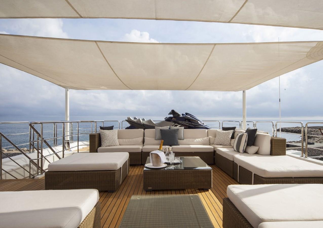 a large living room with a large balcony aboard BEHIKE Yacht for Sale