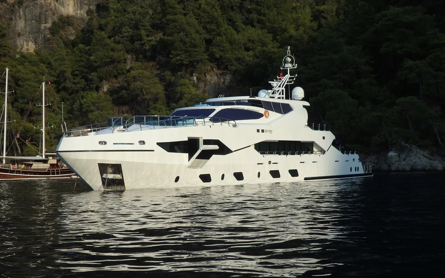 a white yacht on the water aboard DESTINY Yacht for Sale