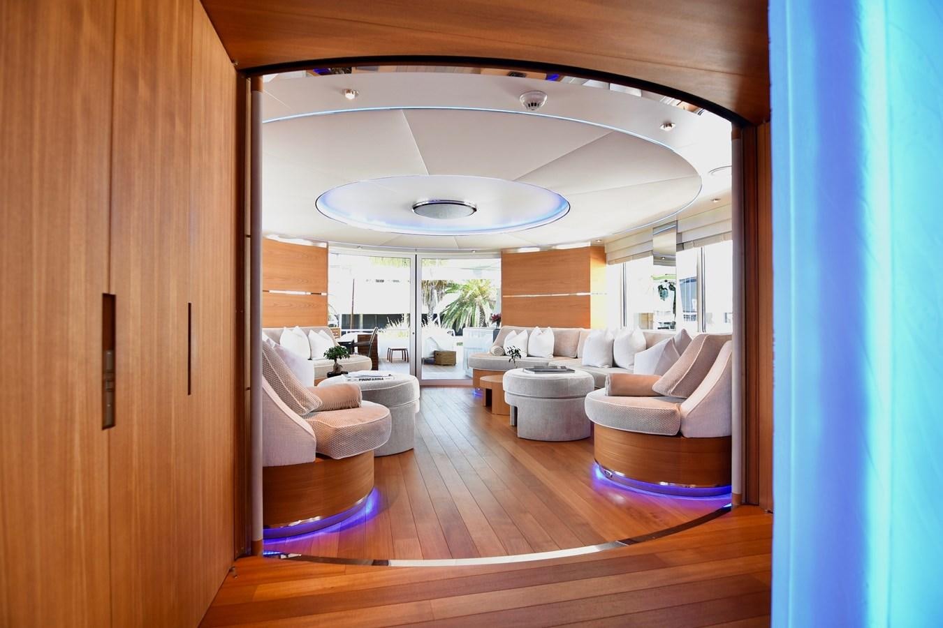 a room with a wood floor and a large mirror aboard LIFE SAGA Yacht for Sale