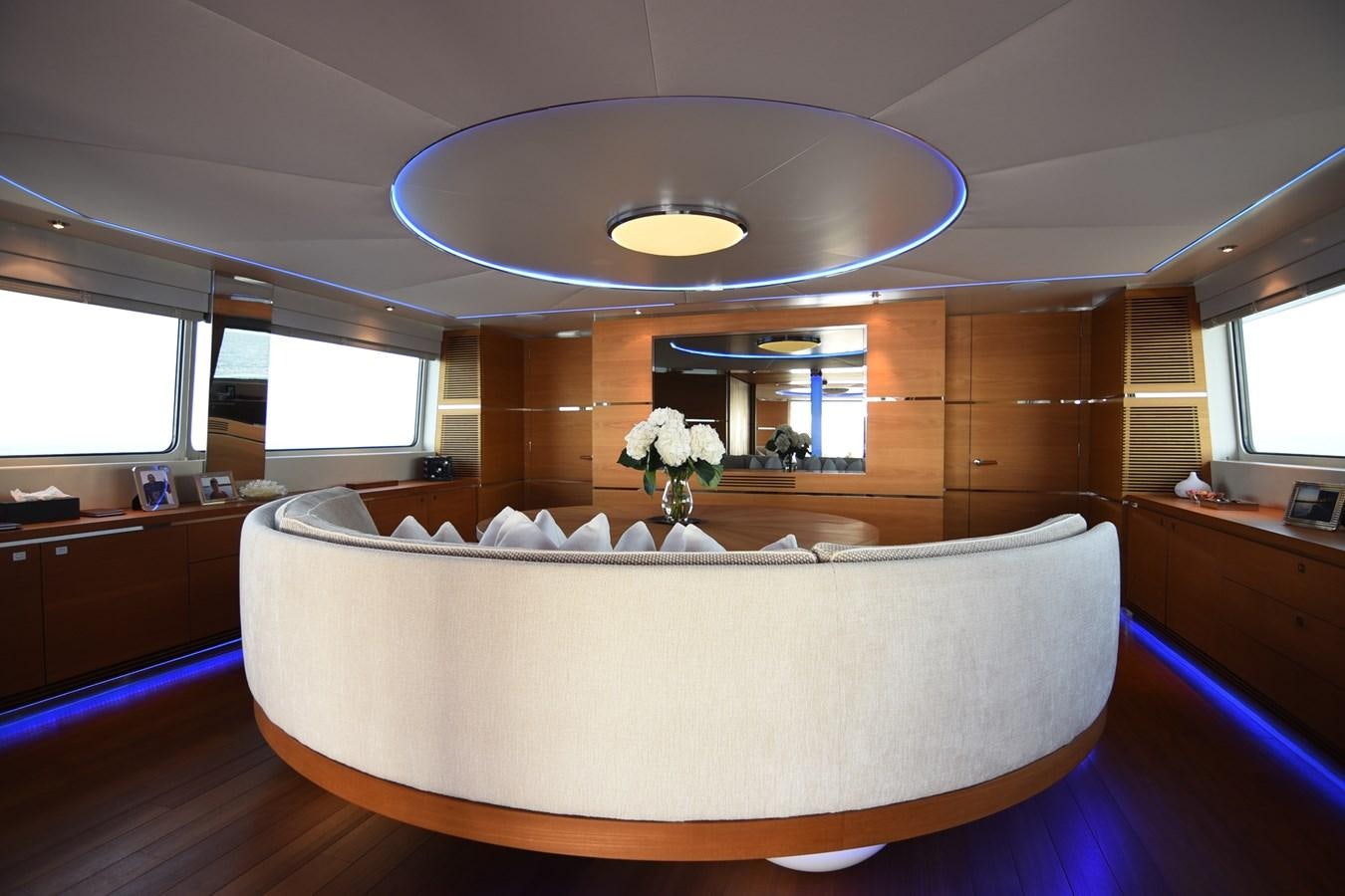 a large white couch in a room aboard LIFE SAGA Yacht for Sale