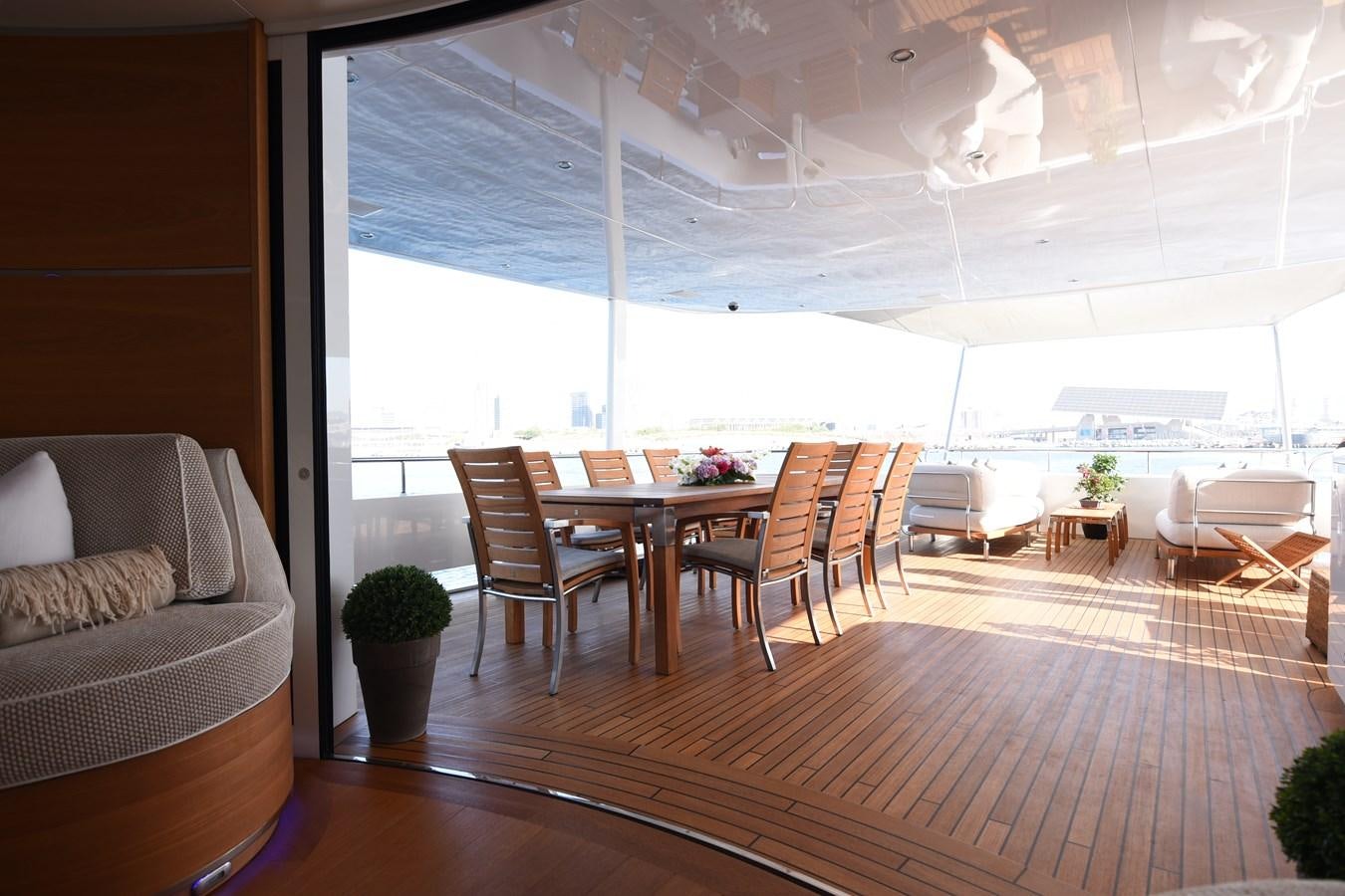 a room with a table and chairs aboard LIFE SAGA Yacht for Sale