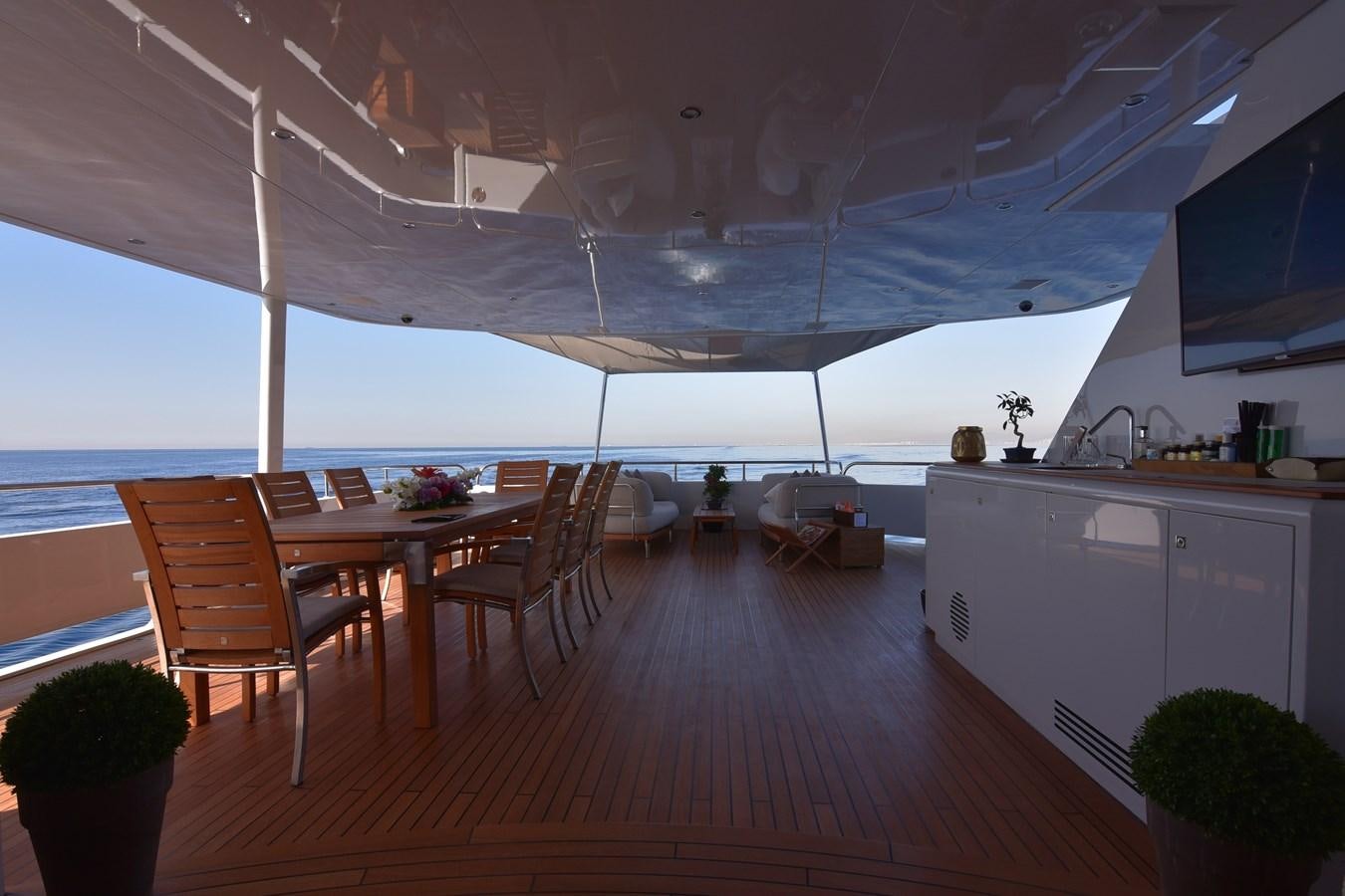 a large open room with a wood floor and a large open window aboard LIFE SAGA Yacht for Sale