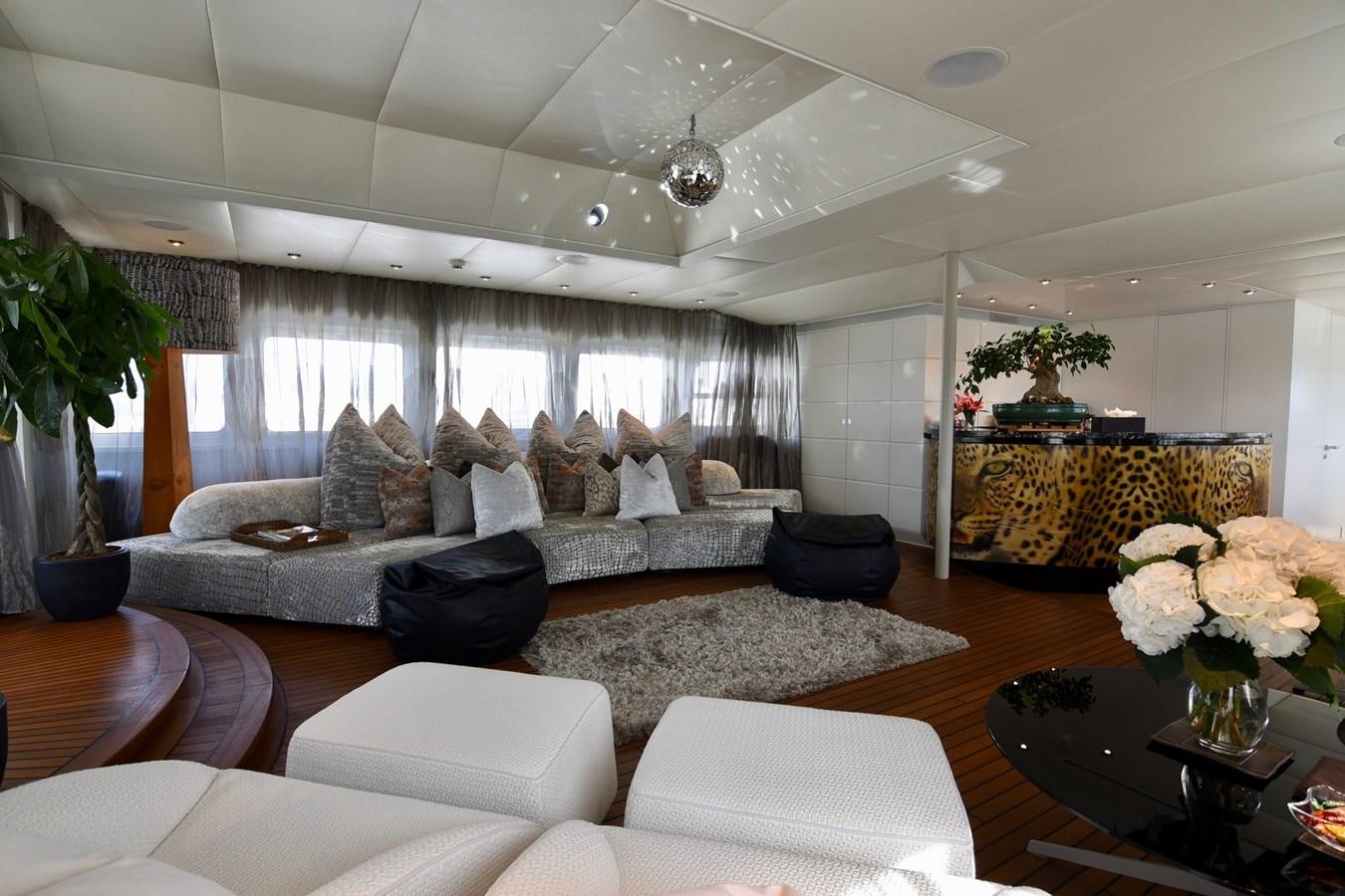 a living room with a large window aboard LIFE SAGA Yacht for Sale