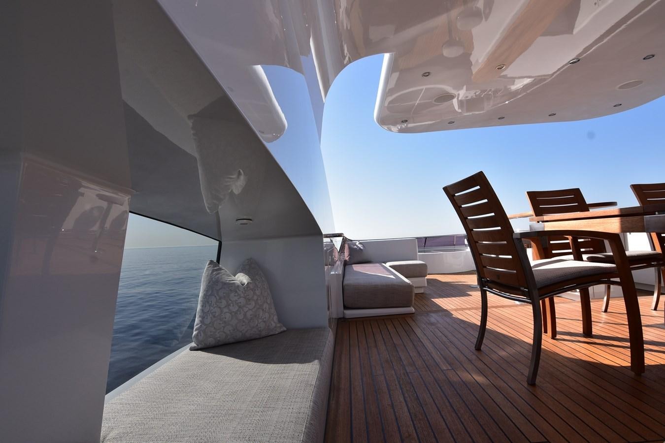 a room with a bed and a chair aboard LIFE SAGA Yacht for Sale