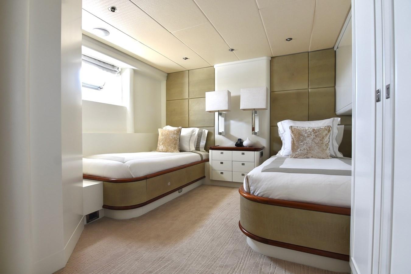 a couple of beds in a hotel room aboard LIFE SAGA Yacht for Sale