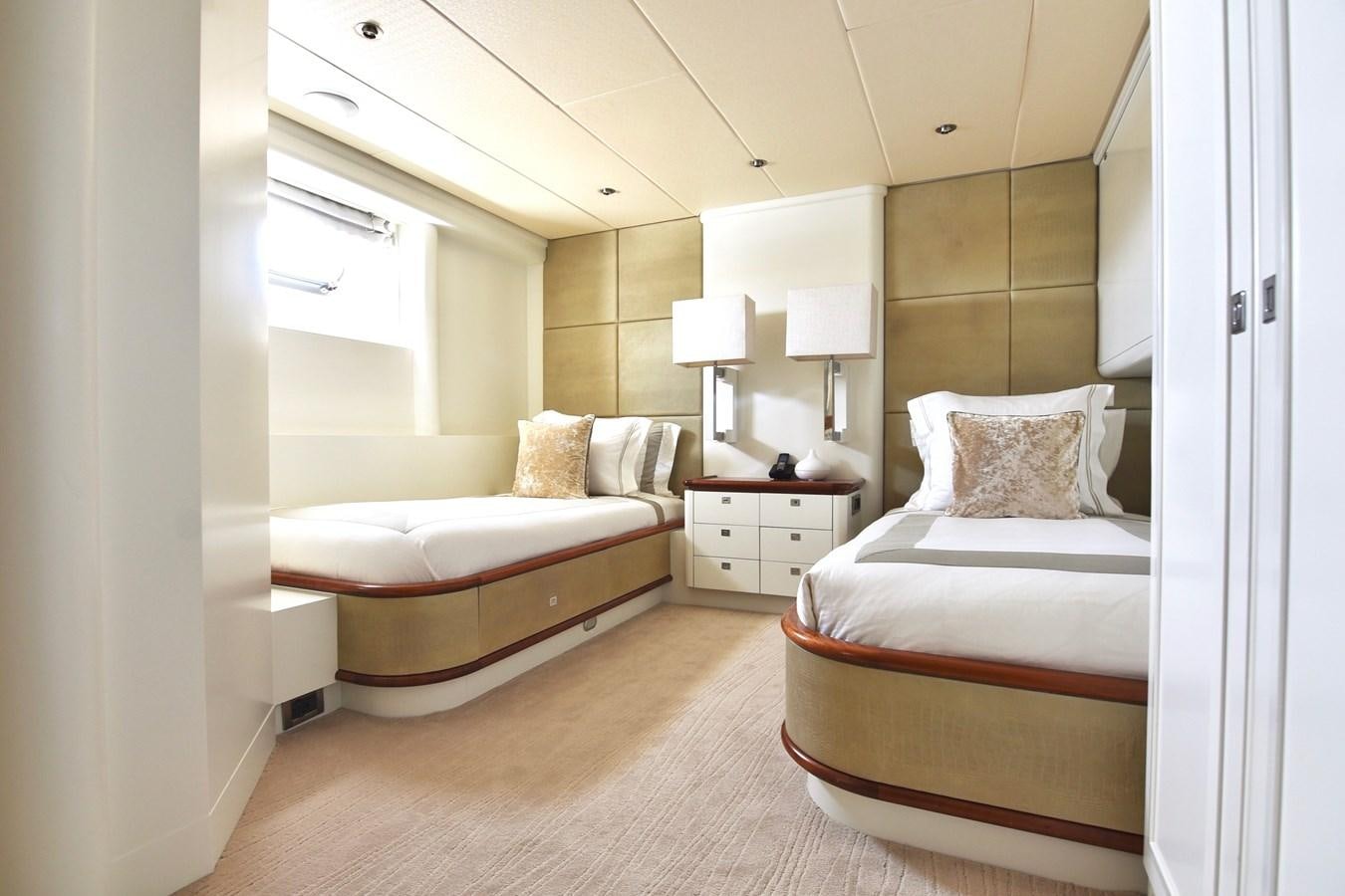 a couple of beds in a hotel room aboard LIFE SAGA Yacht for Sale