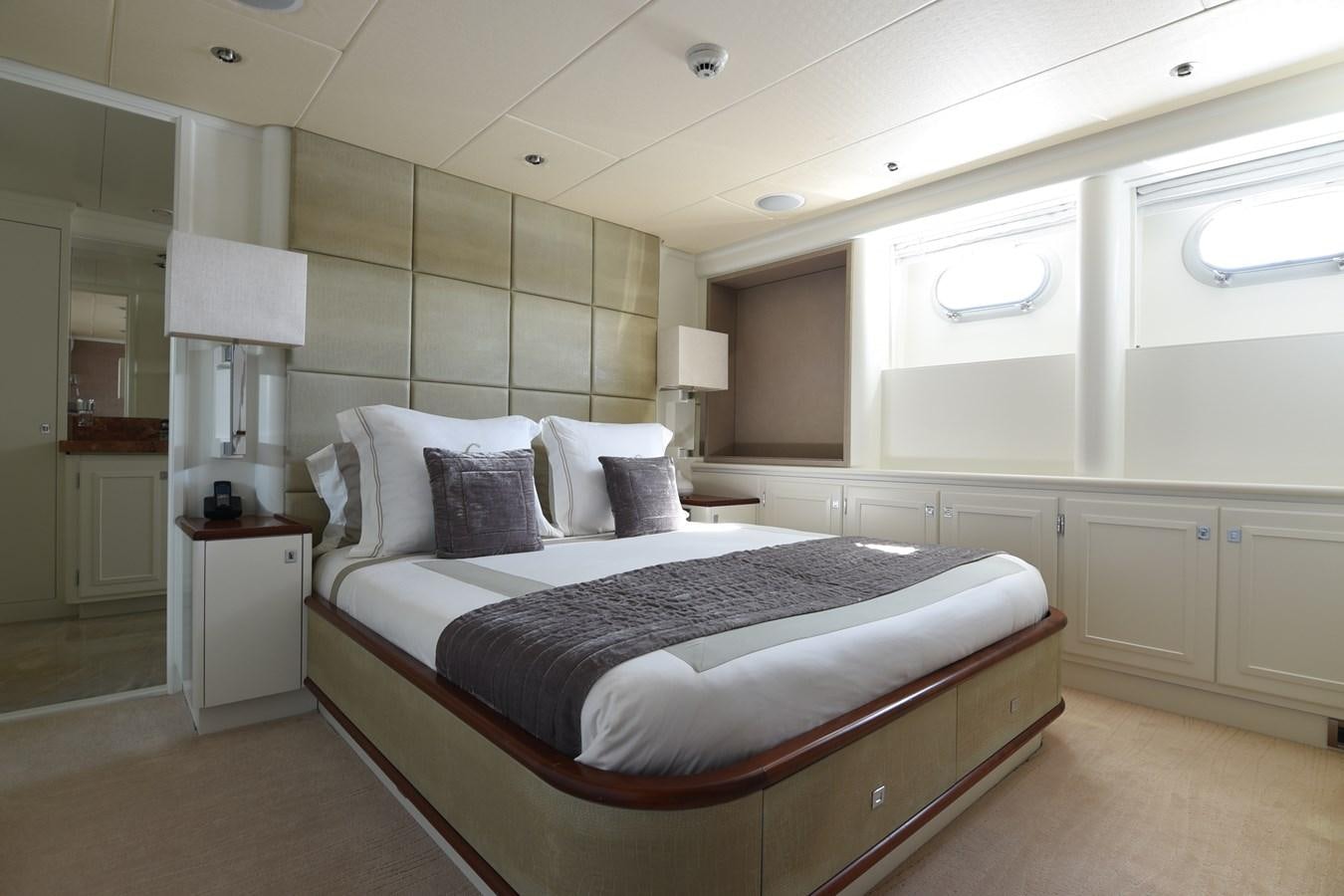 a large bedroom with a bed aboard LIFE SAGA Yacht for Sale