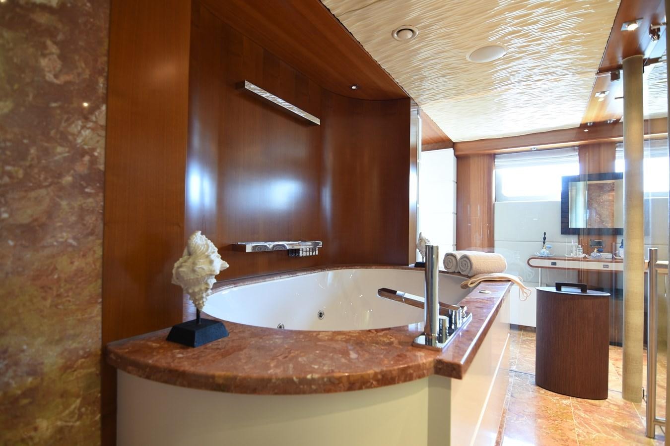 a bathroom with a large bathtub aboard LIFE SAGA Yacht for Charter