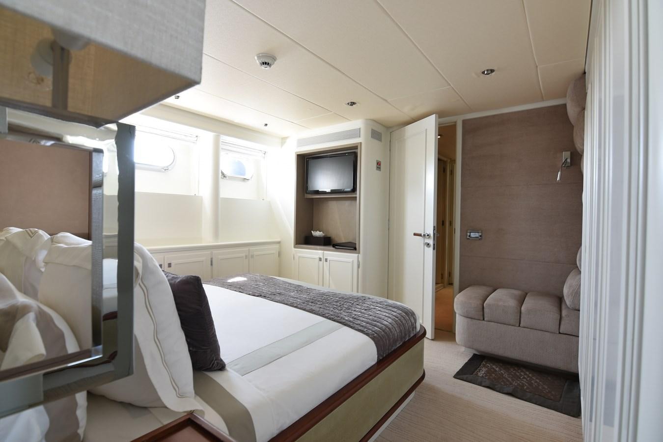 a room with a bed and a couch aboard LIFE SAGA Yacht for Sale
