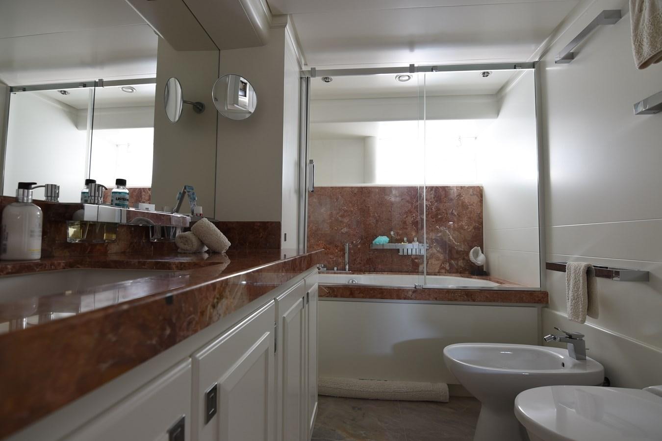 a bathroom with a large tub aboard LIFE SAGA Yacht for Sale