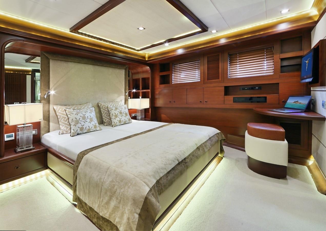 a bed in a room aboard DAIMA Yacht for Sale