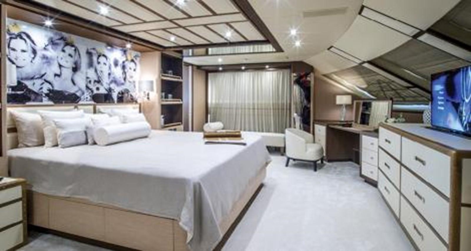 a large bedroom with a large bed aboard NELA Yacht for Charter