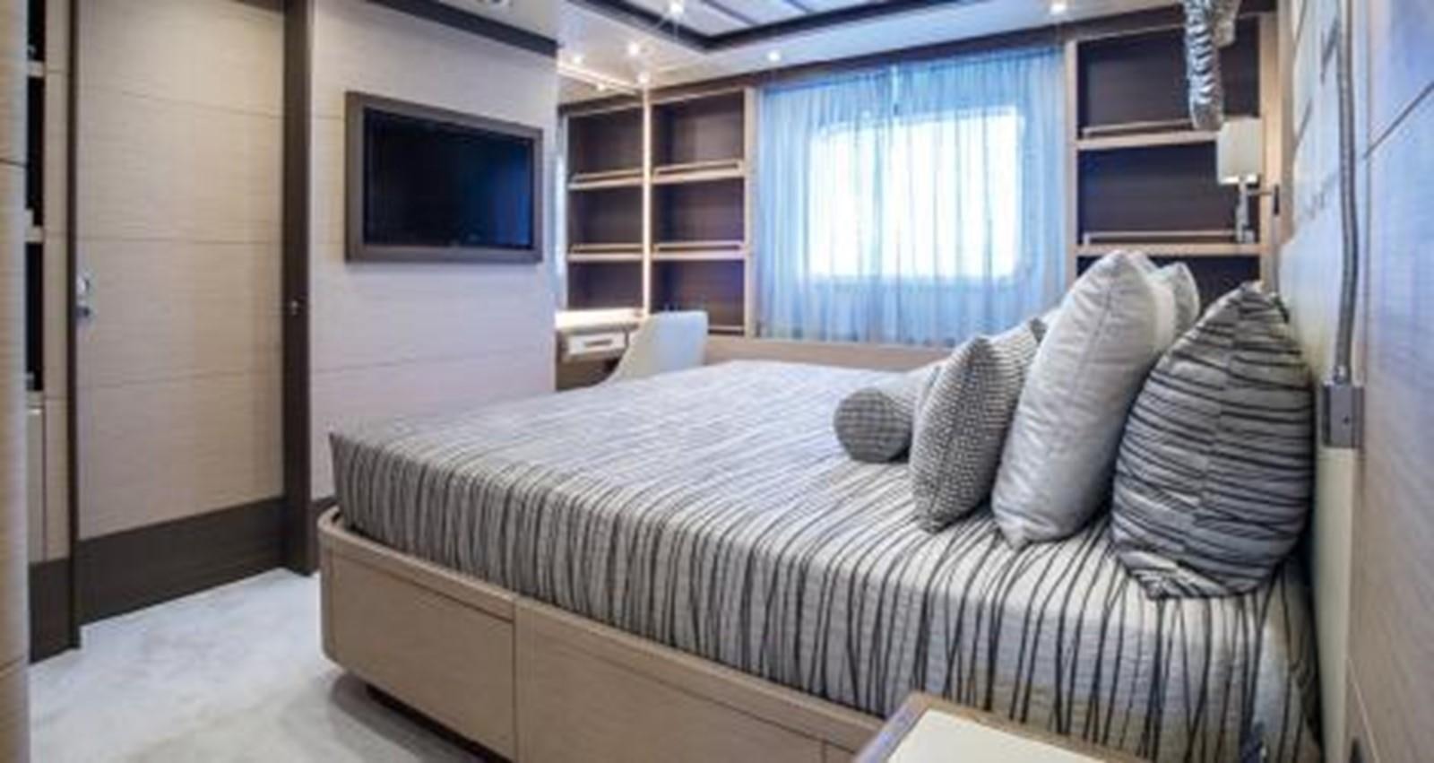 a bed with pillows and pillows aboard NELA Yacht for Sale