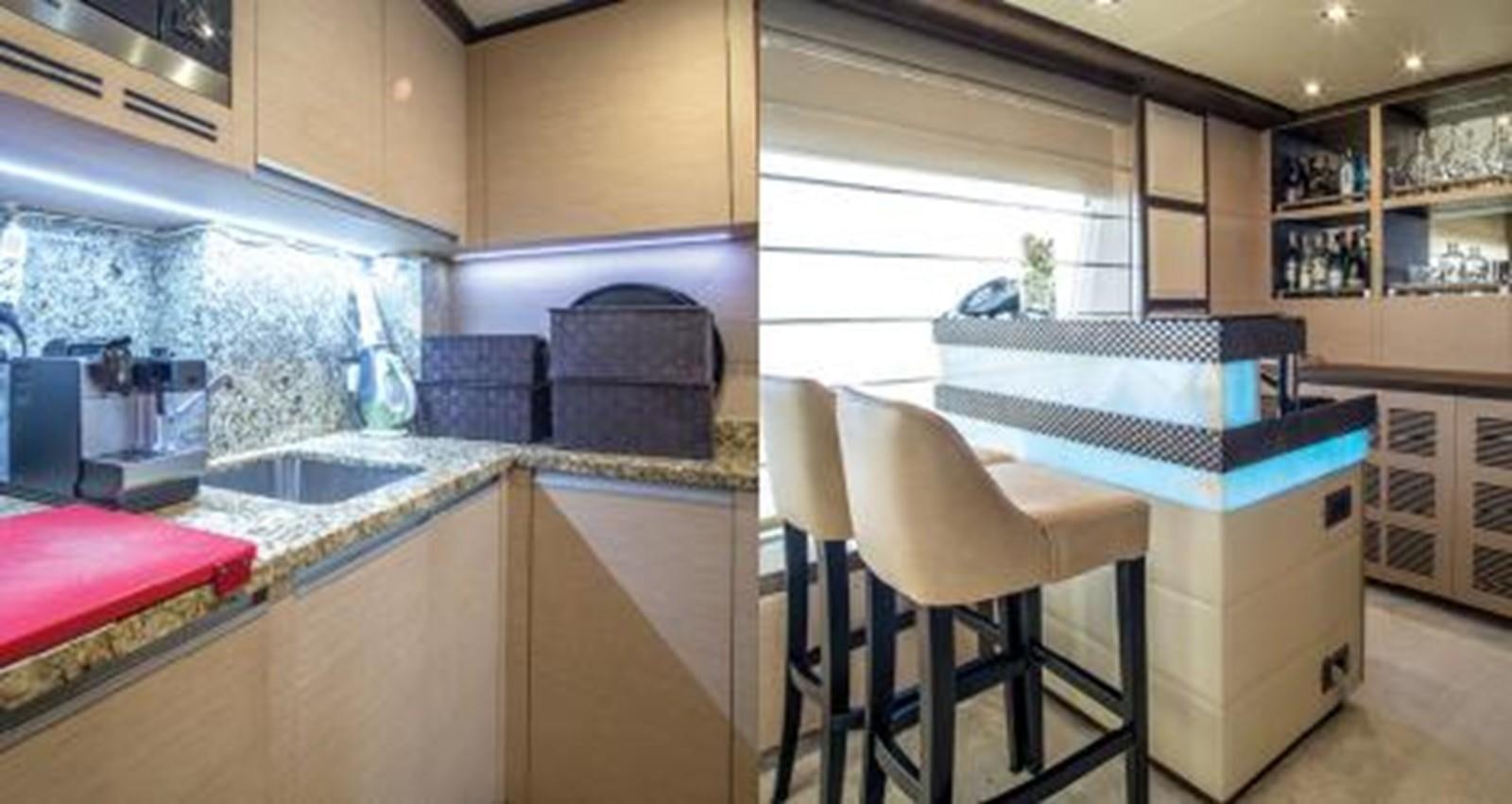 a kitchen with a sink and a microwave aboard NELA Yacht for Sale