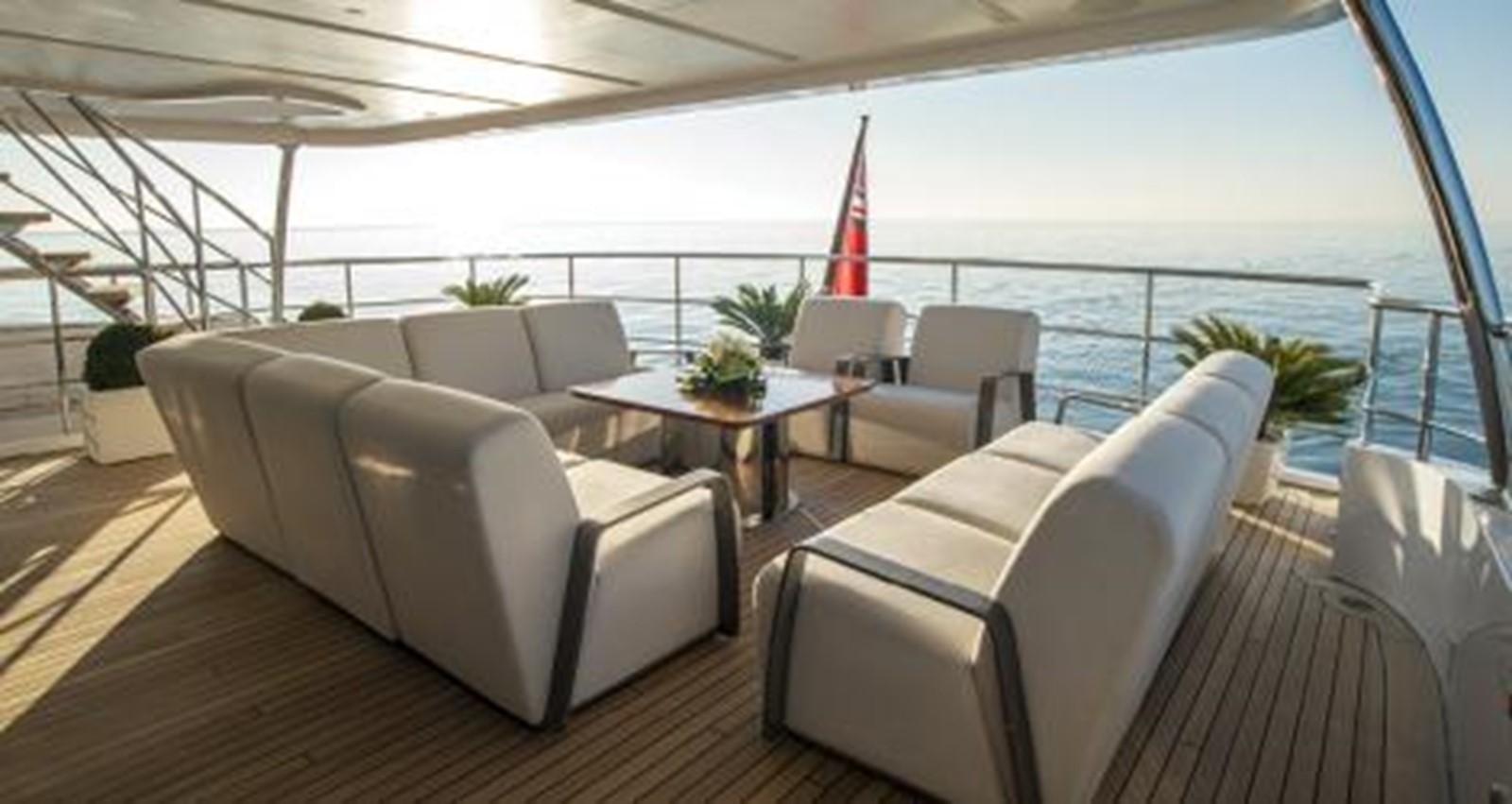 a living room with a view of the ocean aboard NELA Yacht for Sale