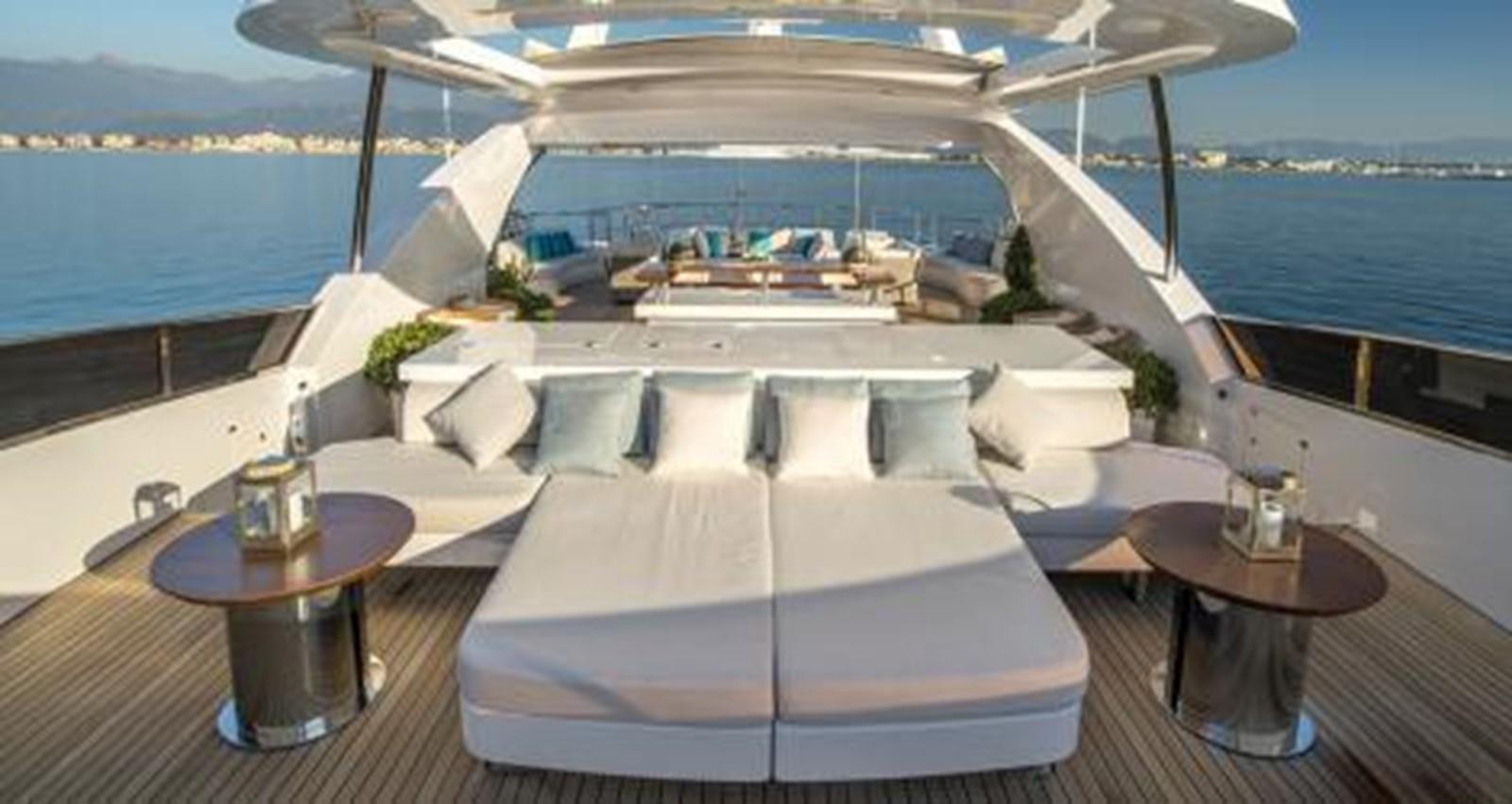a room with a table and chairs aboard NELA Yacht for Sale
