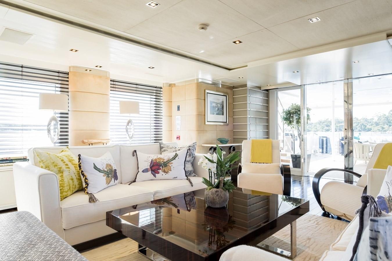 a living room with a large window aboard TIMBUKTU Yacht for Sale