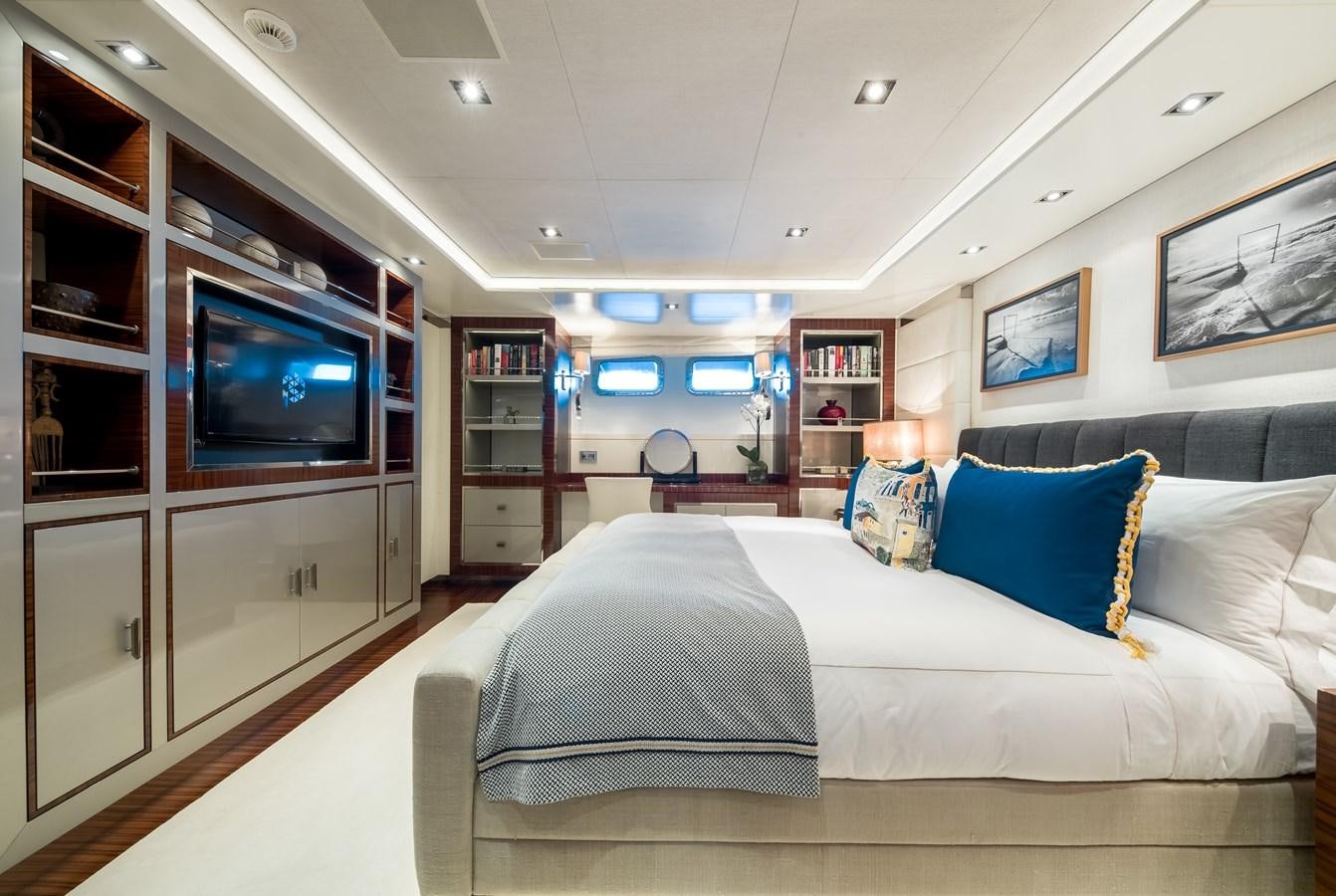 a bedroom with a large bed aboard TIMBUKTU Yacht for Sale