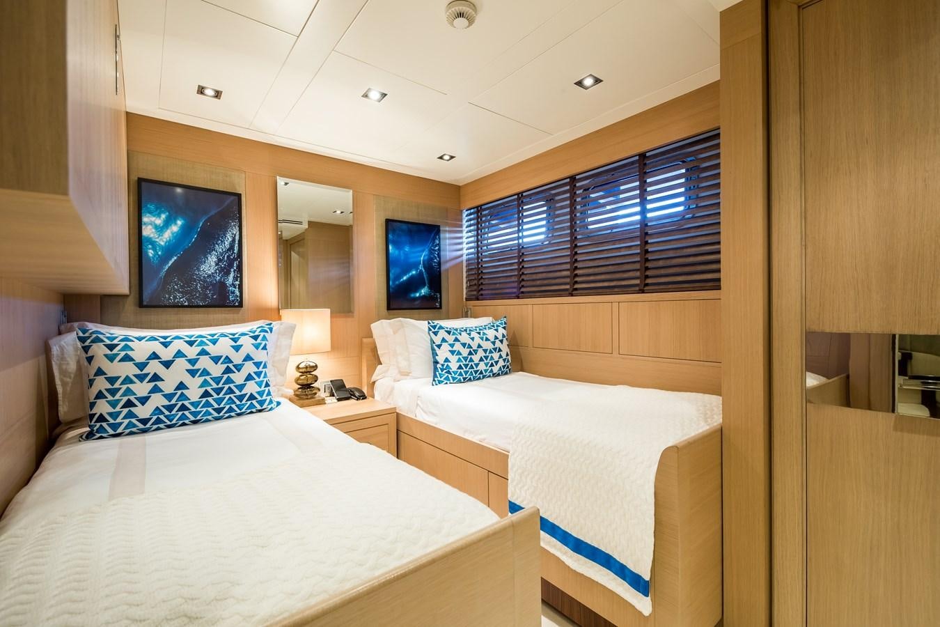 a couple of beds in a hotel room aboard TIMBUKTU Yacht for Sale