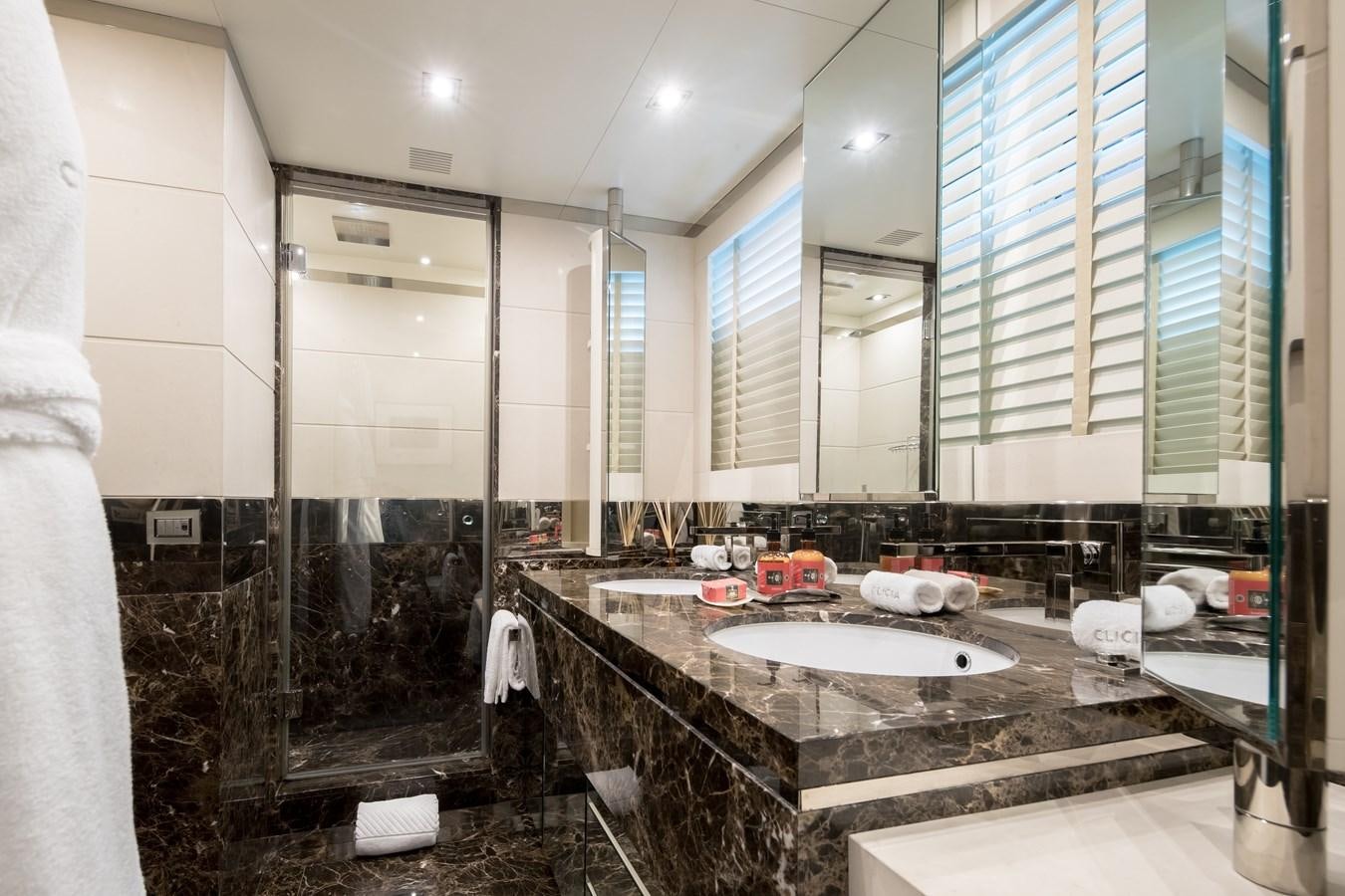 a bathroom with a large marble counter aboard TIMBUKTU Yacht for Sale