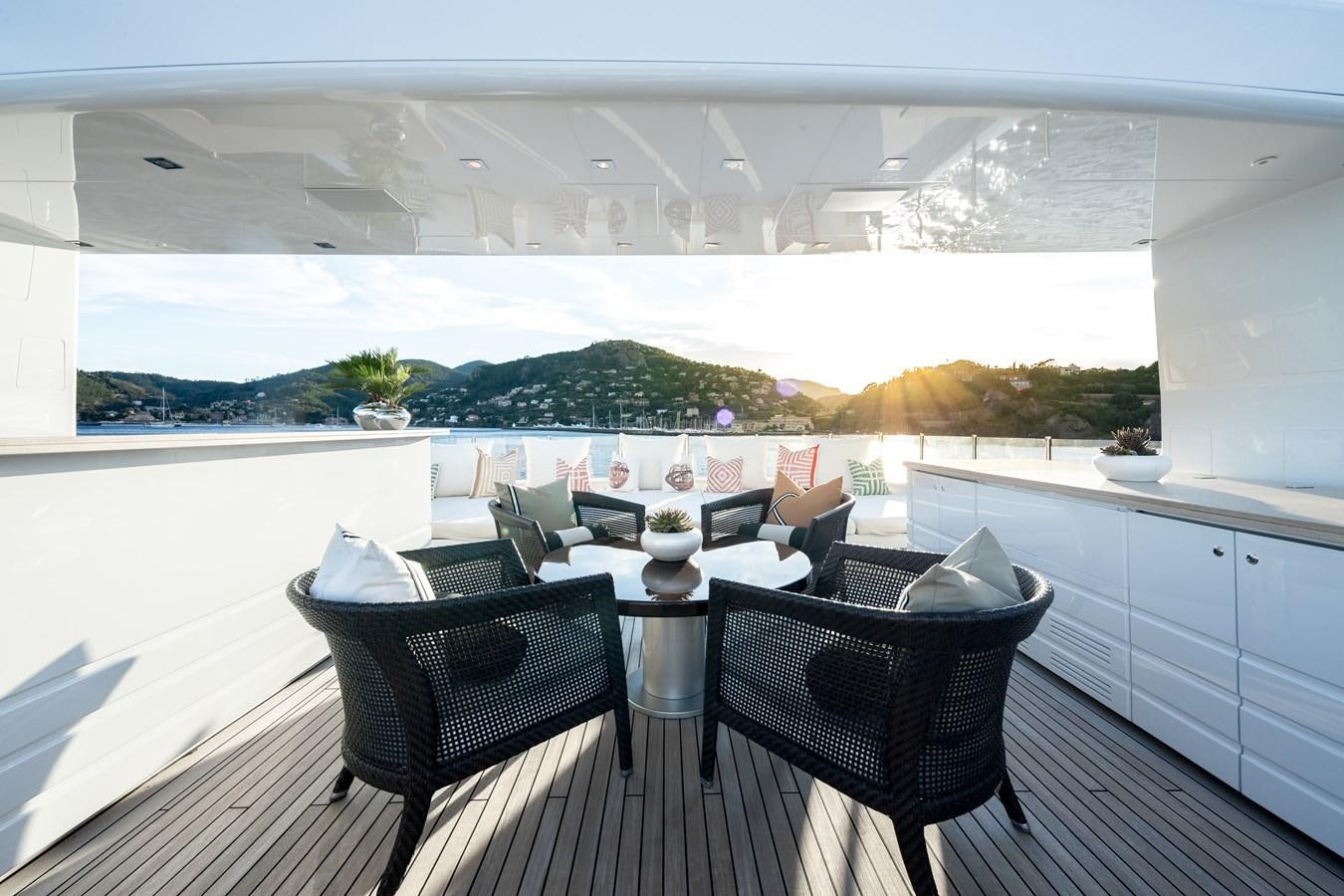 a room with a table and chairs aboard TIMBUKTU Yacht for Sale