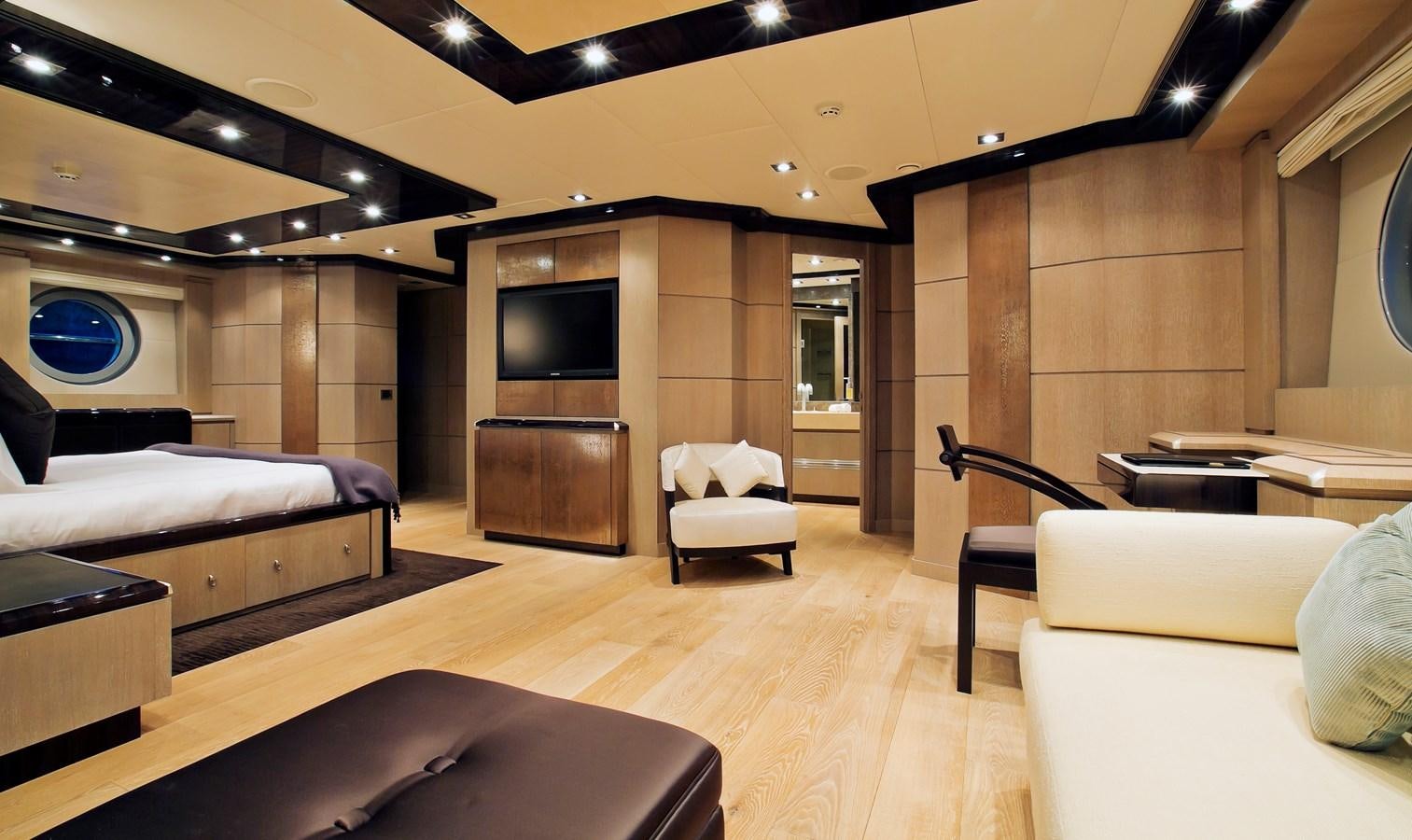 a room with a couch and a tv aboard AK ROYALTY Yacht for Sale