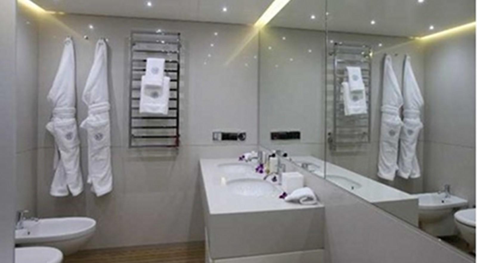 a bathroom with a large mirror aboard OCEAN SAPPHIRE Yacht for Sale