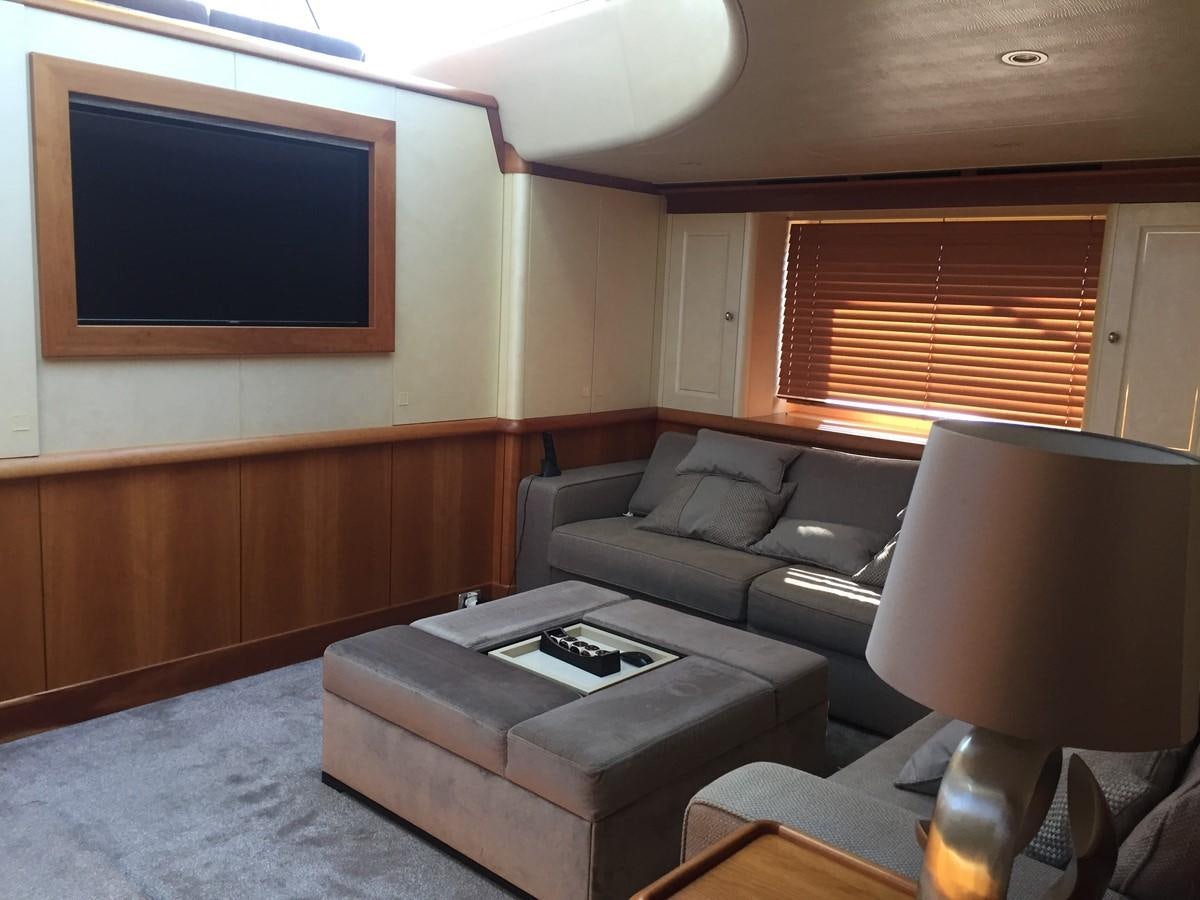 a living room with a couch and a tv aboard INMOCEAN Yacht for Sale