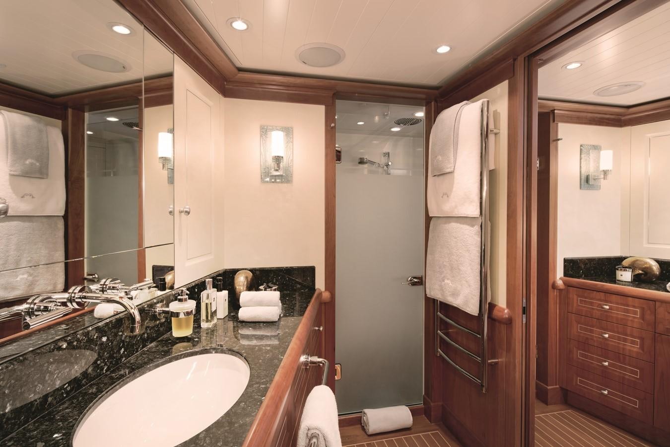 a bathroom with a sink and a shower unit aboard INMOCEAN Yacht for Sale