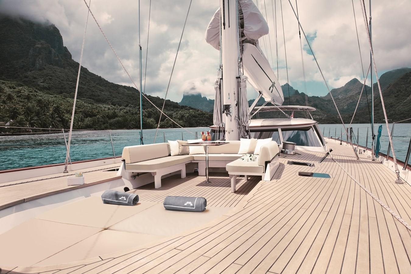 a deck with a boat and a chair on it aboard INMOCEAN Yacht for Sale
