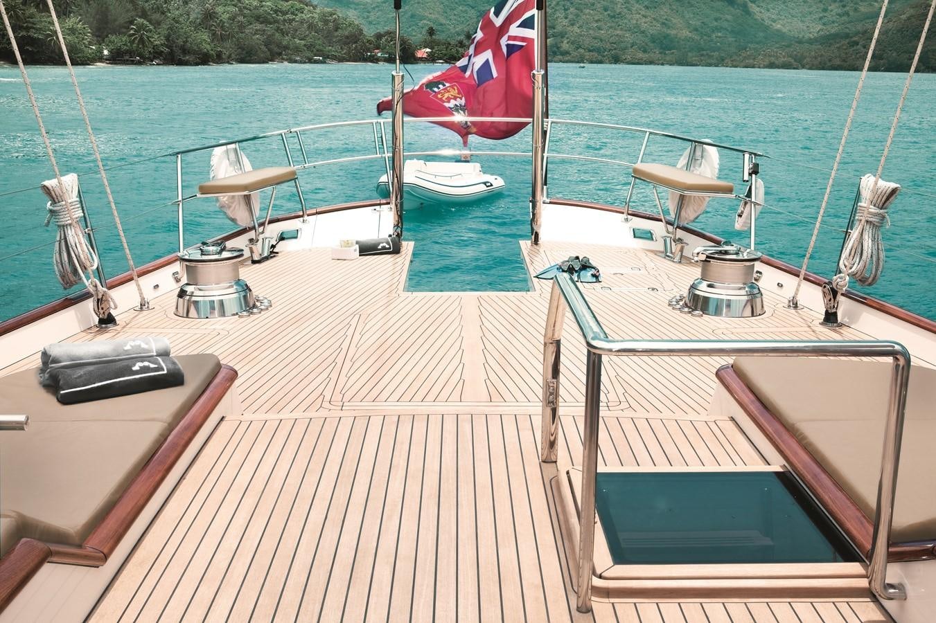 a deck with a boat and a grill on it aboard INMOCEAN Yacht for Sale