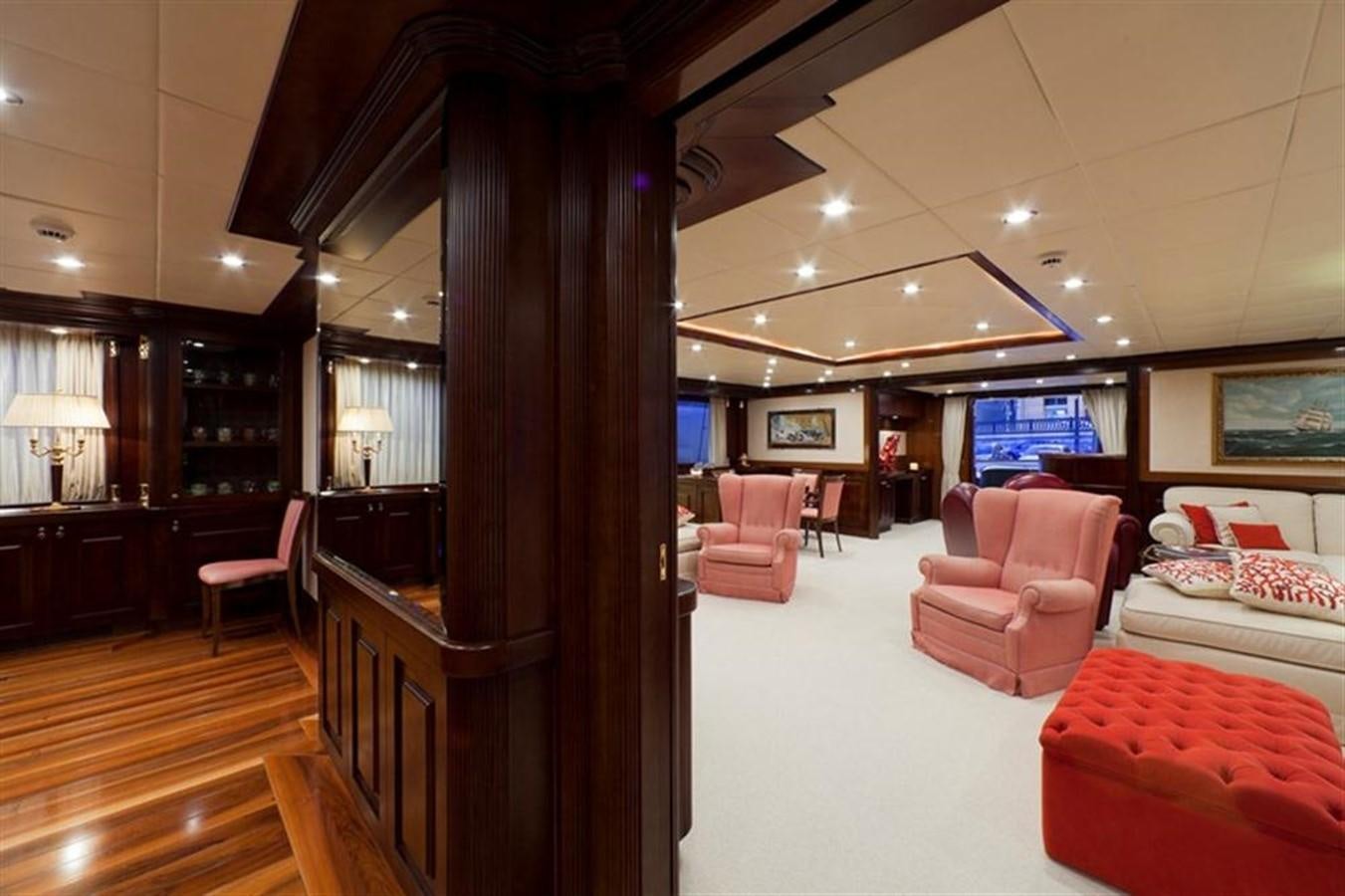 a large living room with a wood floor aboard SOPHIE BLUE Yacht for Sale