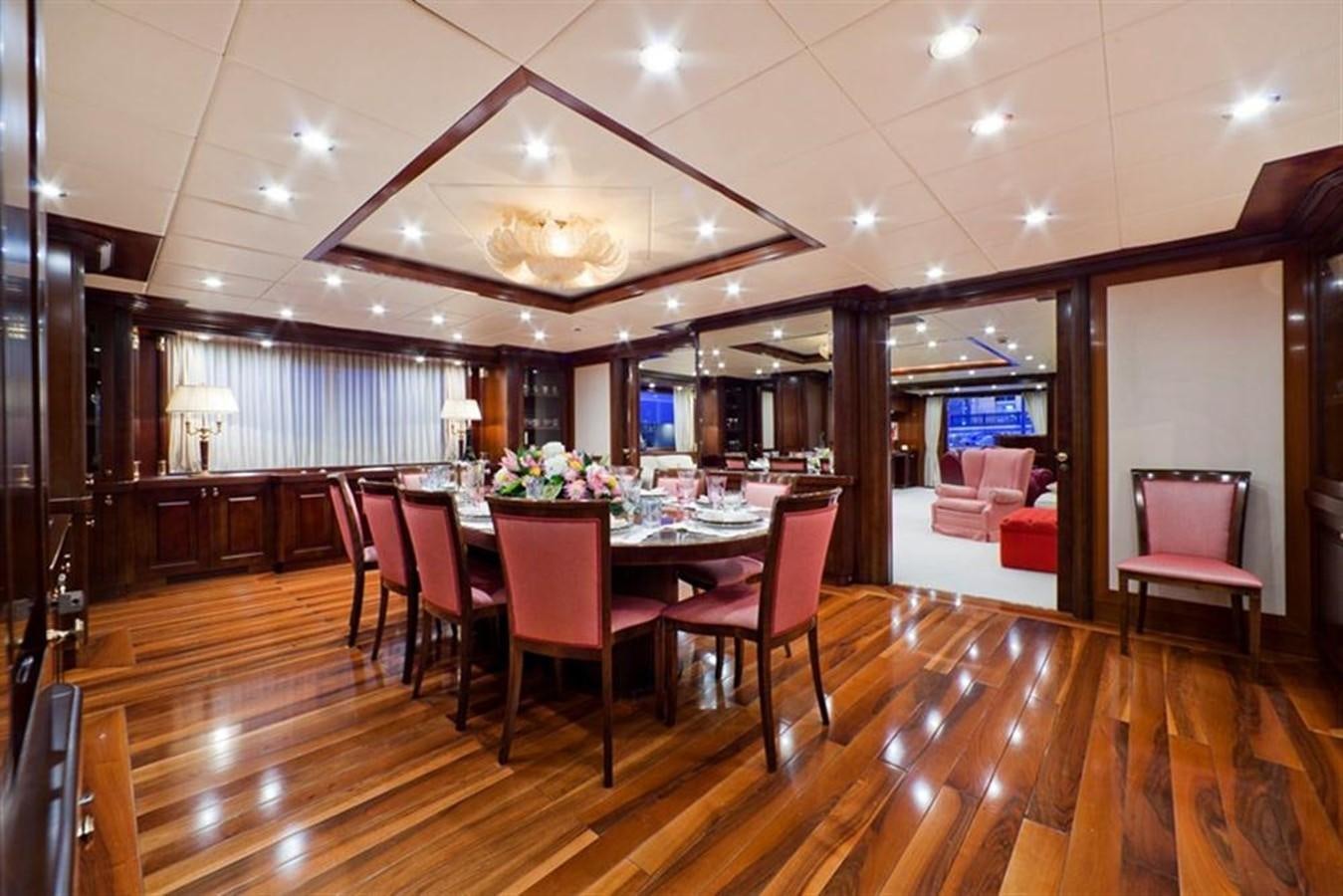 a large dining room with a table and chairs aboard SOPHIE BLUE Yacht for Sale
