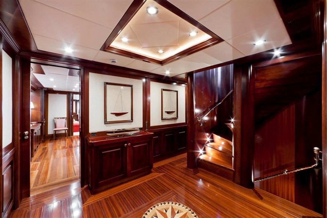 a room with a wood floor and a mirror aboard SOPHIE BLUE Yacht for Sale