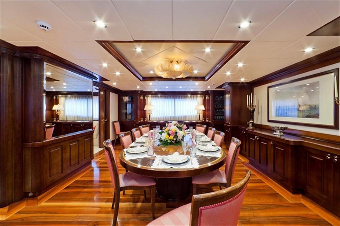 a dining room with a large table aboard SOPHIE BLUE Yacht for Sale