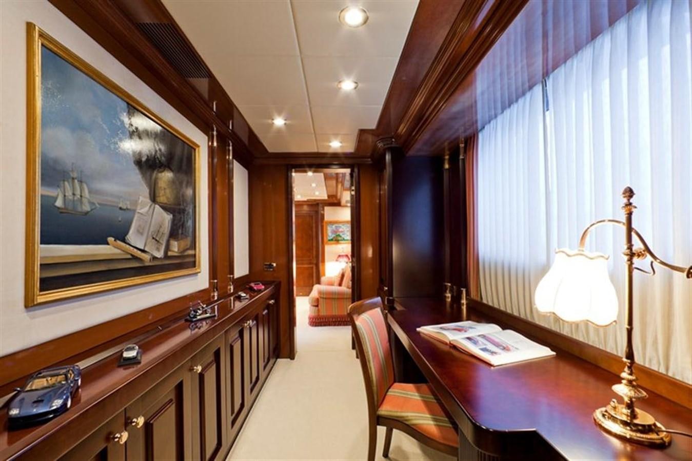 a large room with a table and chairs aboard SOPHIE BLUE Yacht for Sale