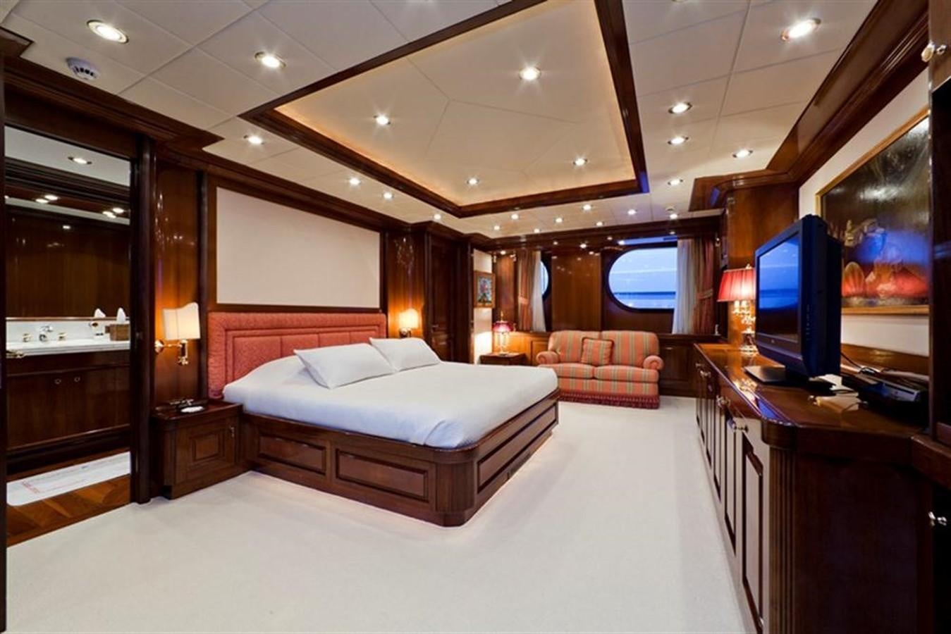 a hotel room with a bed and a tv aboard SOPHIE BLUE Yacht for Sale