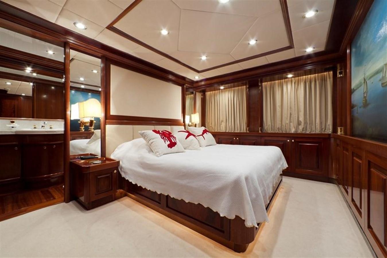 a room with a bed and a mirror aboard SOPHIE BLUE Yacht for Sale