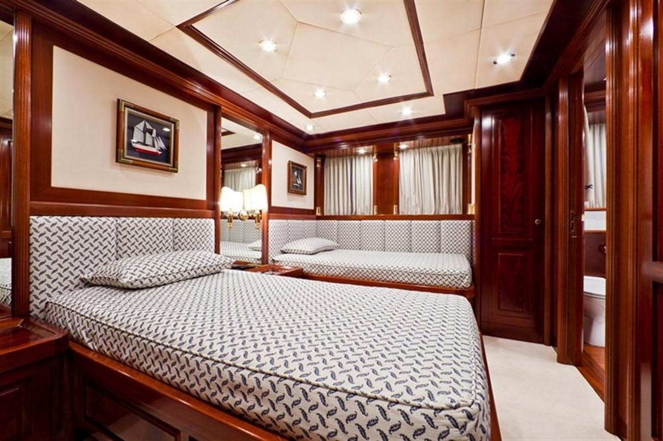 a bedroom with a large bed aboard SOPHIE BLUE Yacht for Sale
