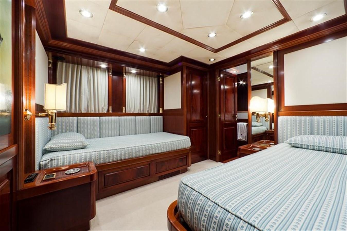 a hotel room with a bed and a desk aboard SOPHIE BLUE Yacht for Sale