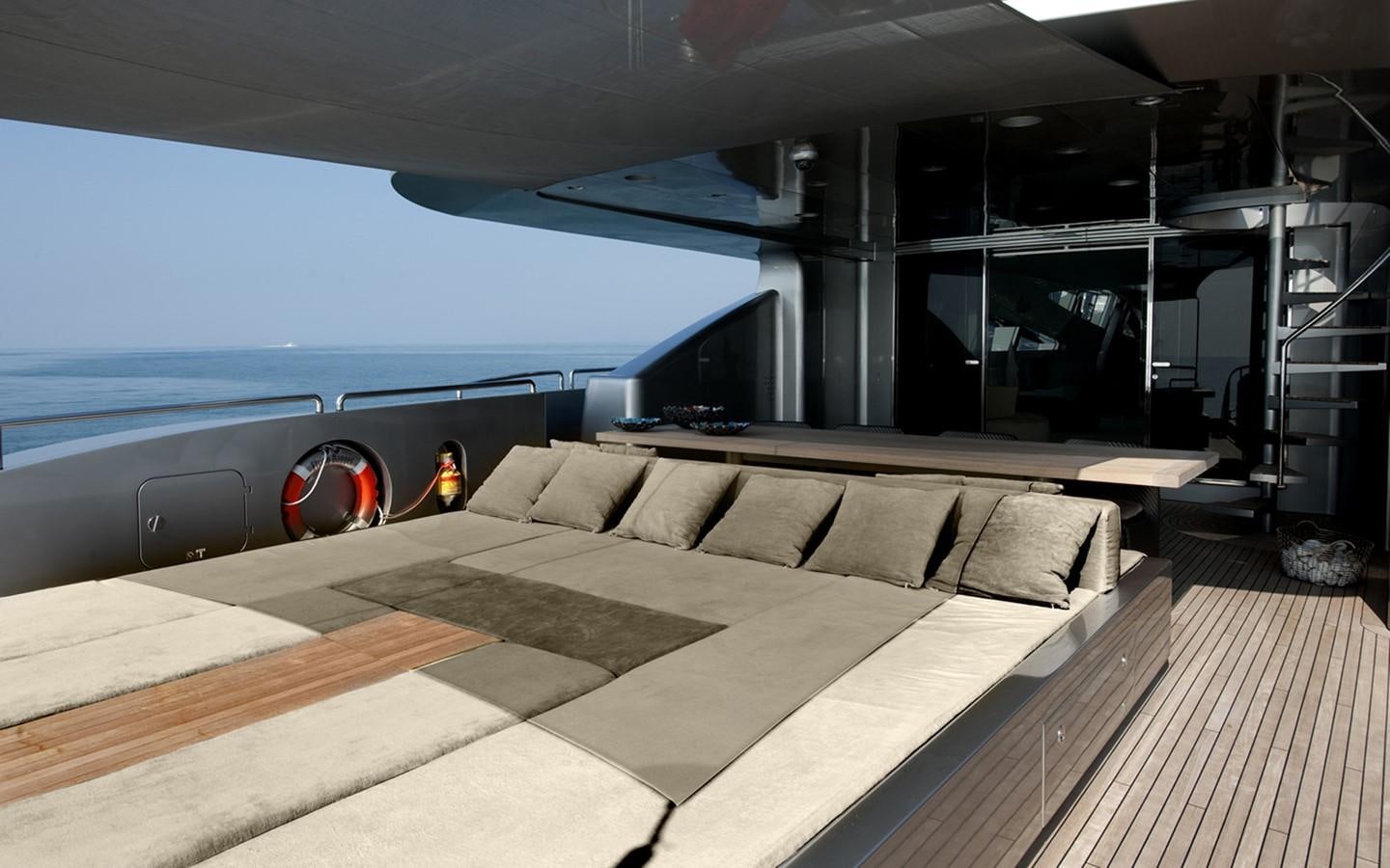 a room with a couch and a pool aboard FLYING DAGGER Yacht for Sale