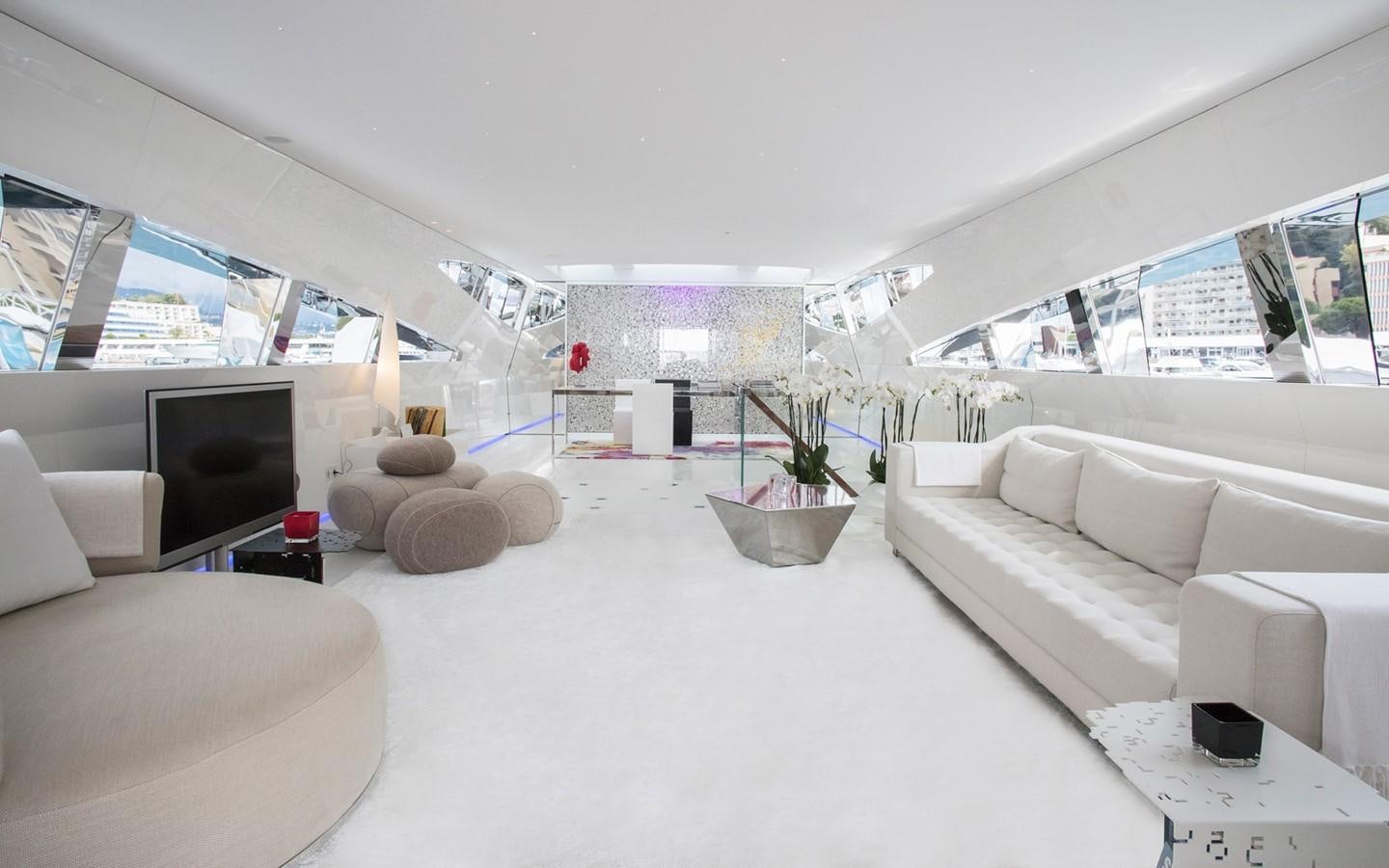 a living room with white couches aboard FLYING DAGGER Yacht for Sale