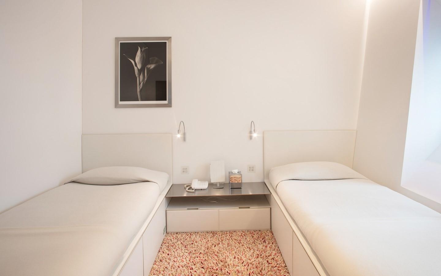 a room with two beds aboard FLYING DAGGER Yacht for Sale