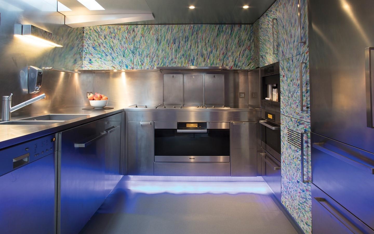 a kitchen with a large island aboard FLYING DAGGER Yacht for Sale