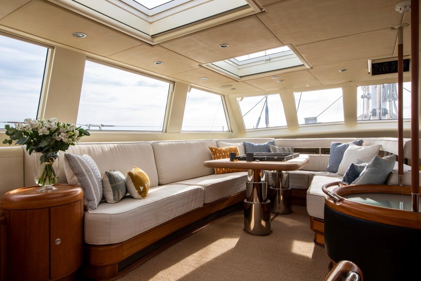 a living room with a couch and a table aboard SURAMA Yacht for Sale
