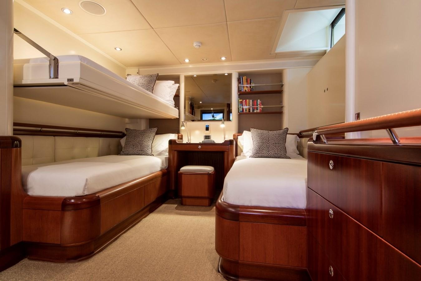 a room with a bed and a desk aboard SURAMA Yacht for Sale