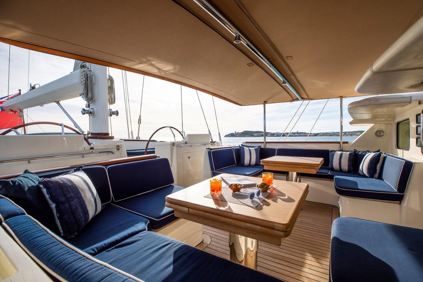 a boat with a table and chairs aboard SURAMA Yacht for Sale
