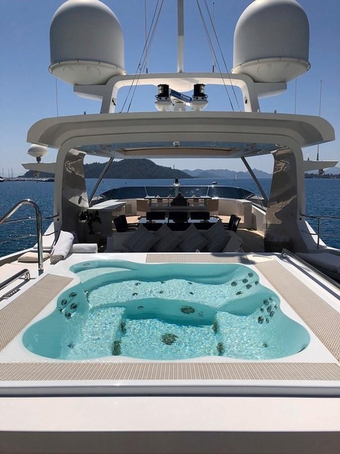 a boat with a blue water fountain aboard ORYX Yacht for Sale