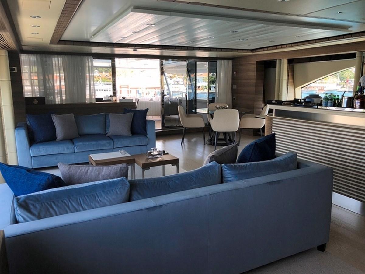 a large living room with a couch aboard ORYX Yacht for Sale
